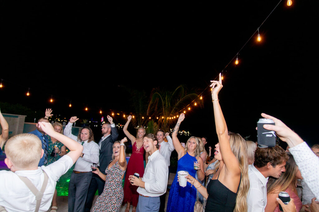 Candid dancing and joyful moments at an Ocean City backyard wedding reception