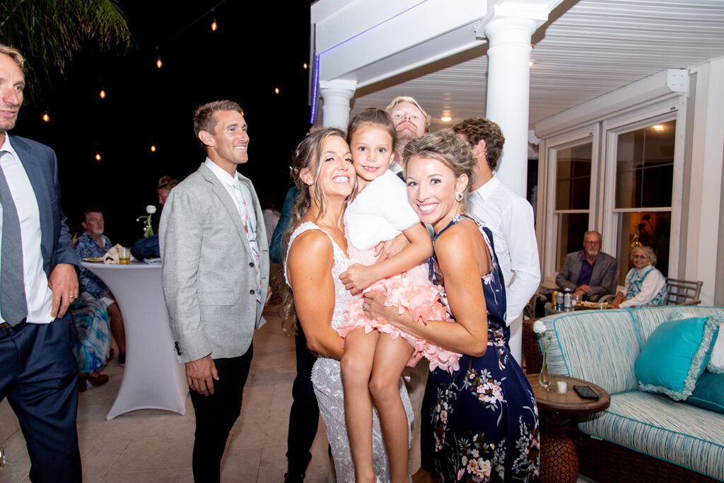 Candid dancing and joyful moments at an Ocean City backyard wedding reception