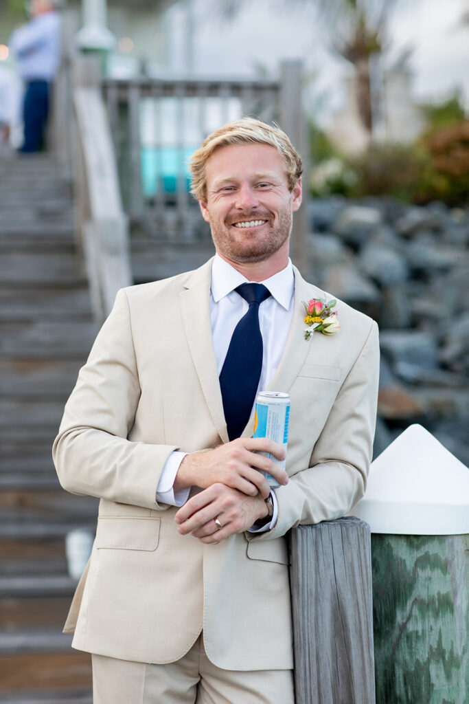 Romantic yet playful couple portraits at an Ocean City MD bayfront wedding