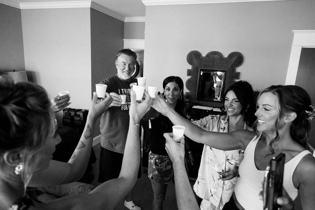 Bride sharing candid, fun moments with friends before an Ocean City beach wedding