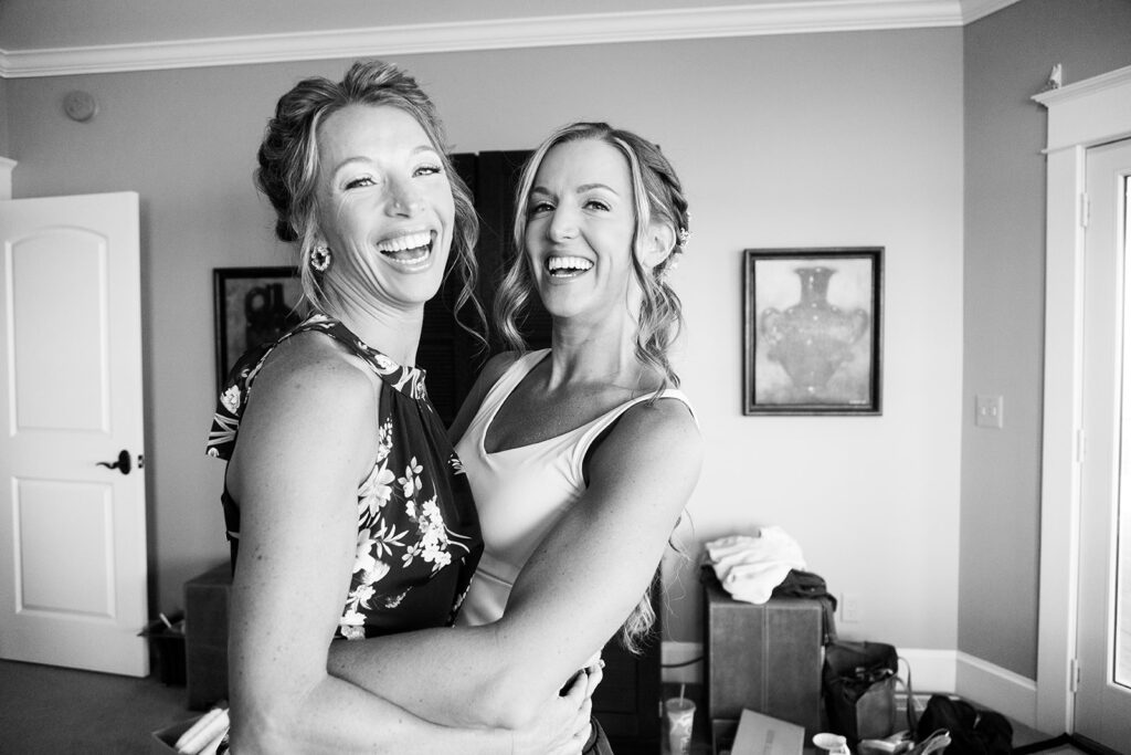 Bride sharing candid, fun moments with friends before an Ocean City beach wedding