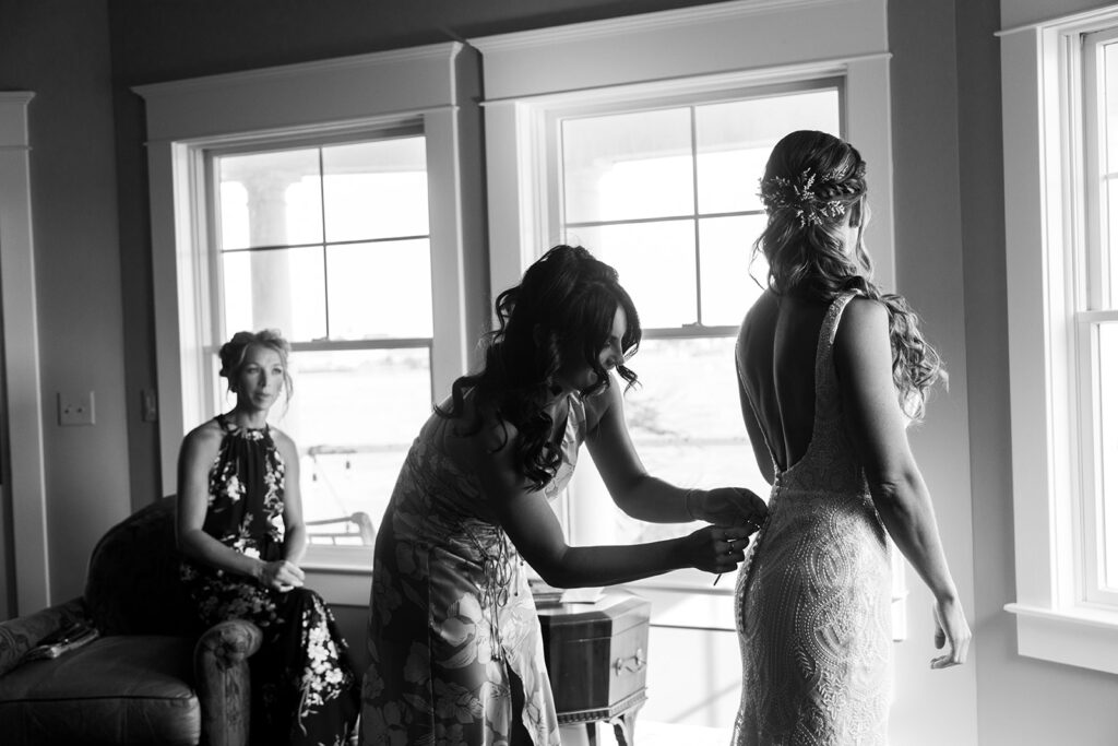 Bride getting ready with friends during a relaxed Ocean City MD beach wedding
