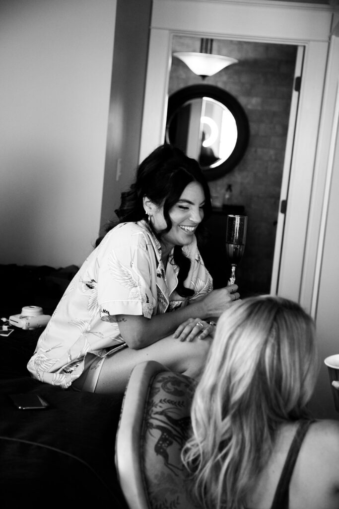 Bride sharing candid, fun moments with friends before an Ocean City beach wedding