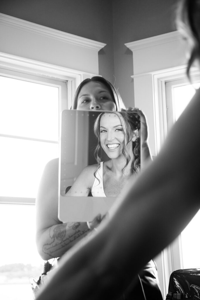 Bride sharing candid, fun moments with friends before an Ocean City beach wedding