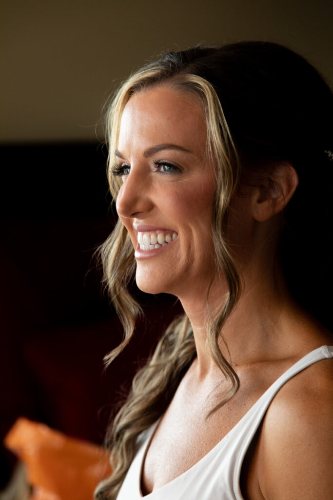 Bride sharing candid, fun moments with friends before an Ocean City beach wedding