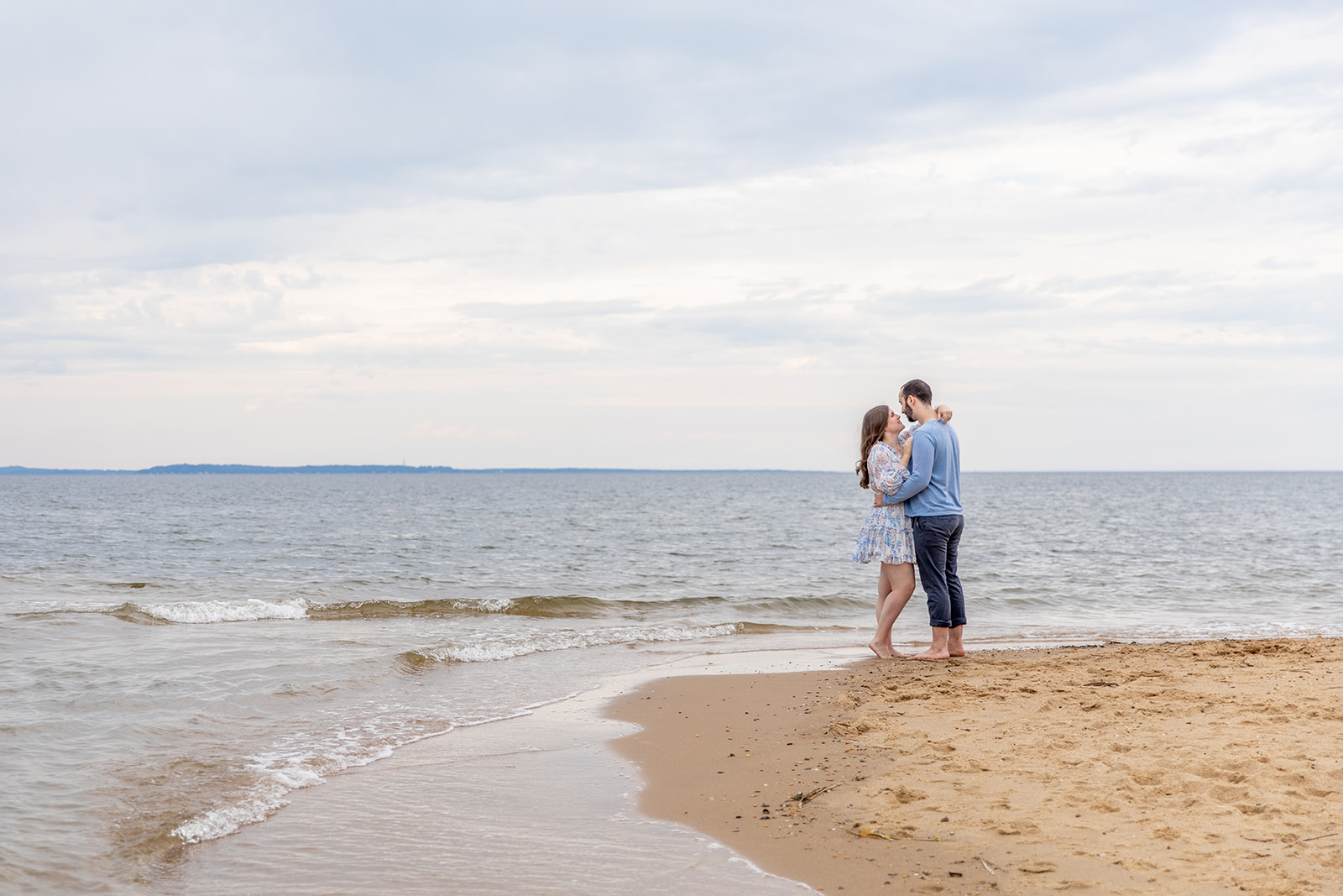 Beach engagement photos near DC of Ben and Amanda at Terrapin Nature Park with bay views at sunset