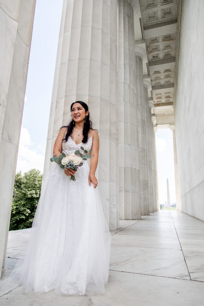 Bride laughing during first look with groom