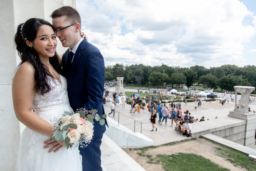 Bride and groom standing together at the Lincoln Memorial during a Washington DC elopement