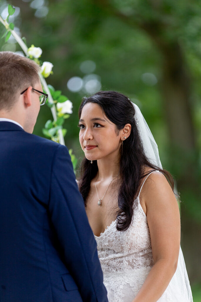 Bride looking at groom during an intimate DC War Memorial elopement ceremony