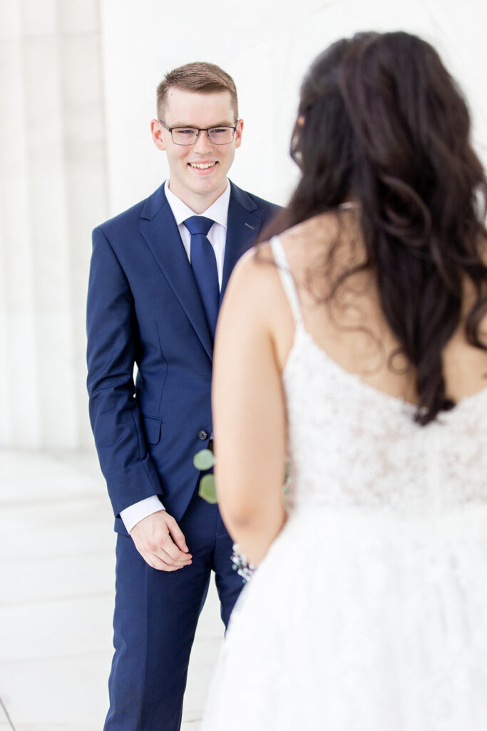 Emotional first look reaction at the Lincoln Memorial captured by DC elopement photographer
