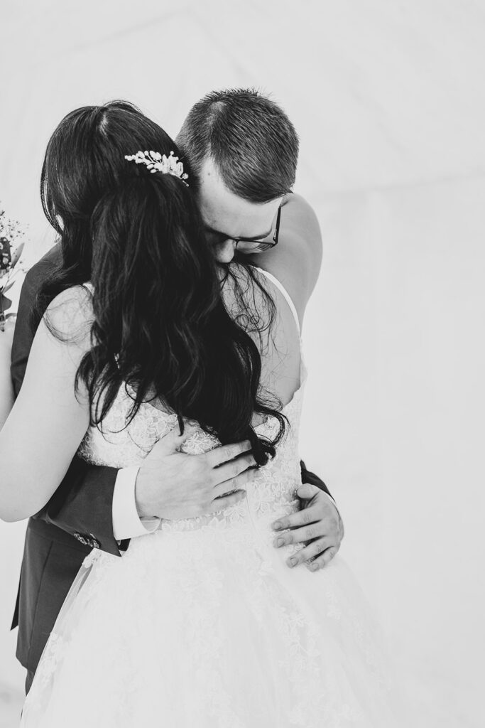 Emotional embrace during Lincoln Memorial elopement in Washington DC