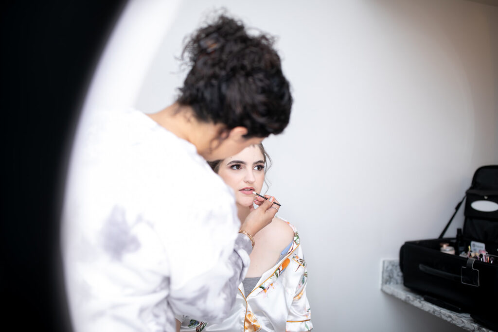 Bride getting ready in the bridal suite at The Woodlands at Algonkian in spring