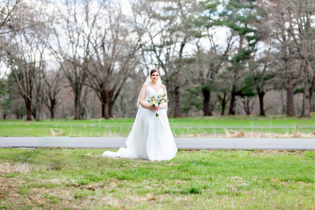 First look wedding photos at The Woodlands at Algonkian by evergreen trees