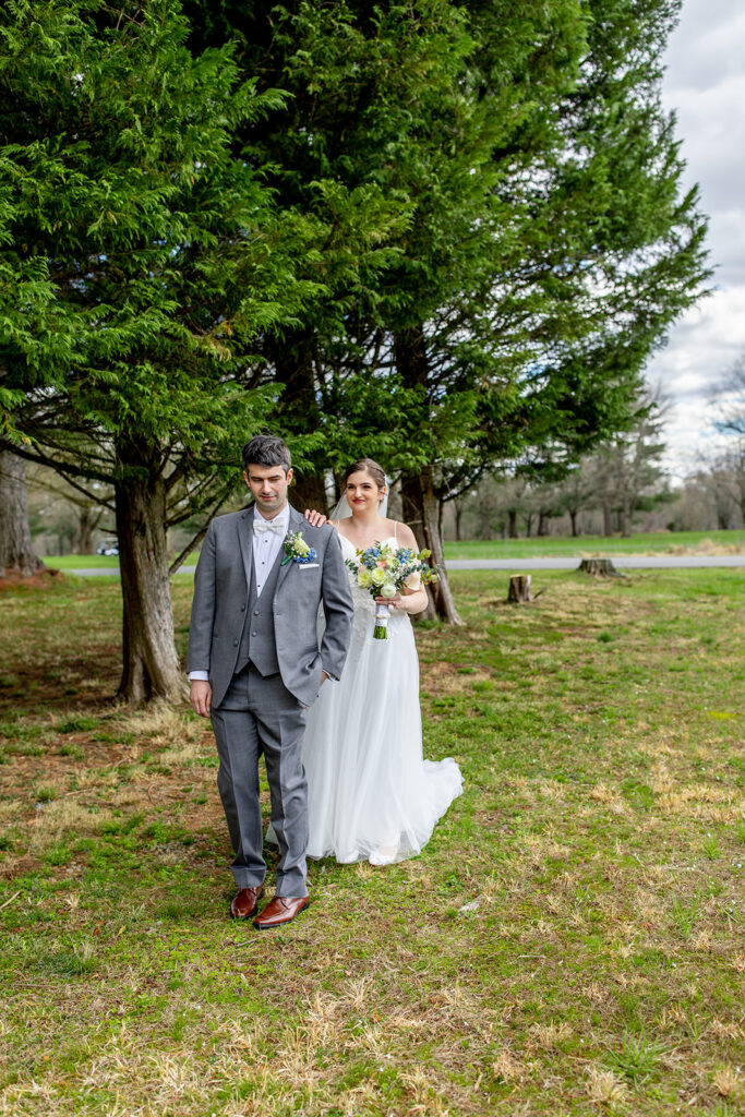 First look wedding photos at The Woodlands at Algonkian by evergreen trees