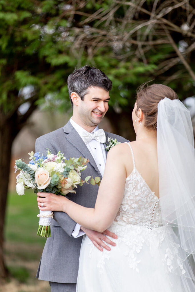 First look wedding photos at The Woodlands at Algonkian by evergreen trees