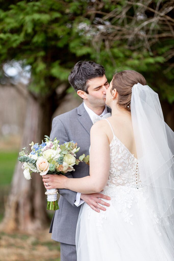 First look wedding photos at The Woodlands at Algonkian by evergreen trees
