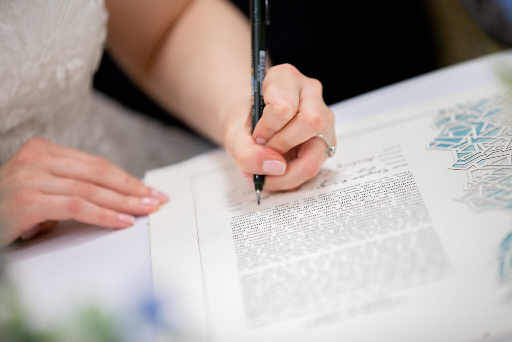 Intimate Jewish ketubah signing before ceremony at The Woodlands at Algonkian