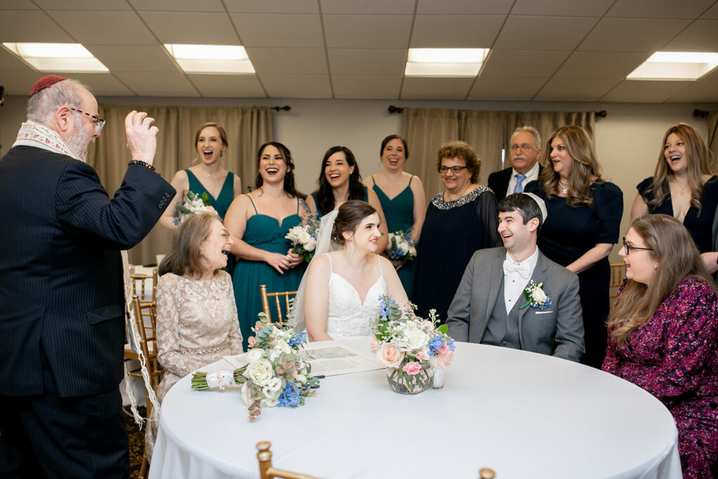 Intimate Jewish ketubah signing before ceremony at The Woodlands at Algonkian