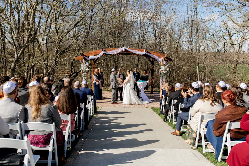 Spring outdoor wedding ceremony setup at The Woodlands at Algonkian
