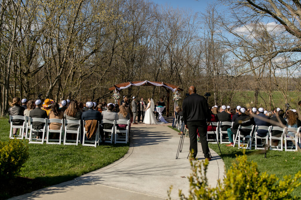 Spring outdoor wedding ceremony setup at The Woodlands at Algonkian