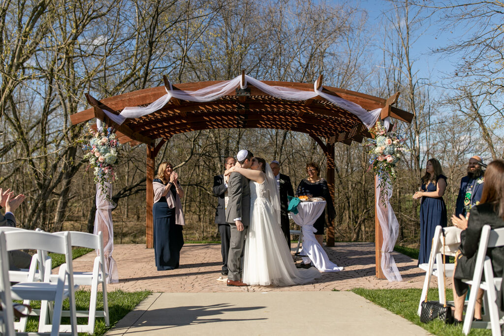 Spring outdoor wedding ceremony setup at The Woodlands at Algonkian