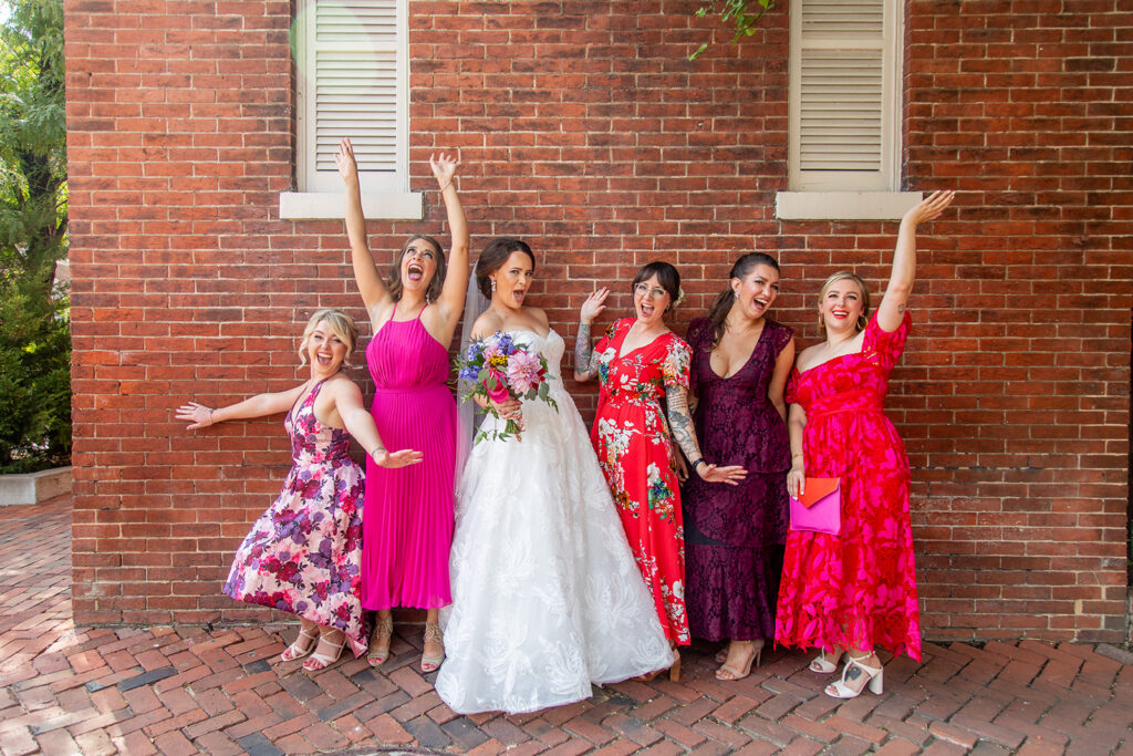 Bride celebrating with her bridal party during an intimate wedding in Old Town Alexandria.