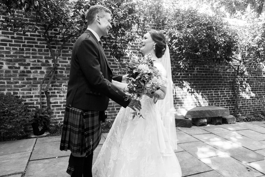 Bride and groom holding hands during their intimate first look in Alexandria, Virginia.