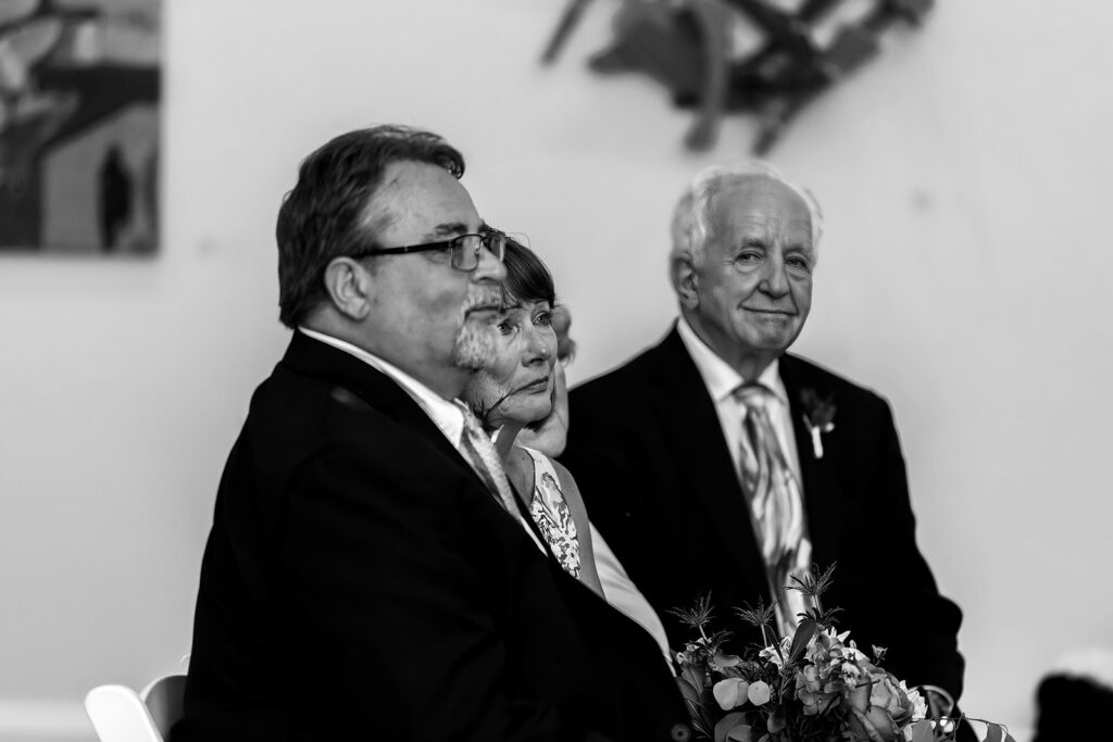 Wedding guests reacting emotionally during an intimate ceremony at the Athenaeum in Alexandria.
