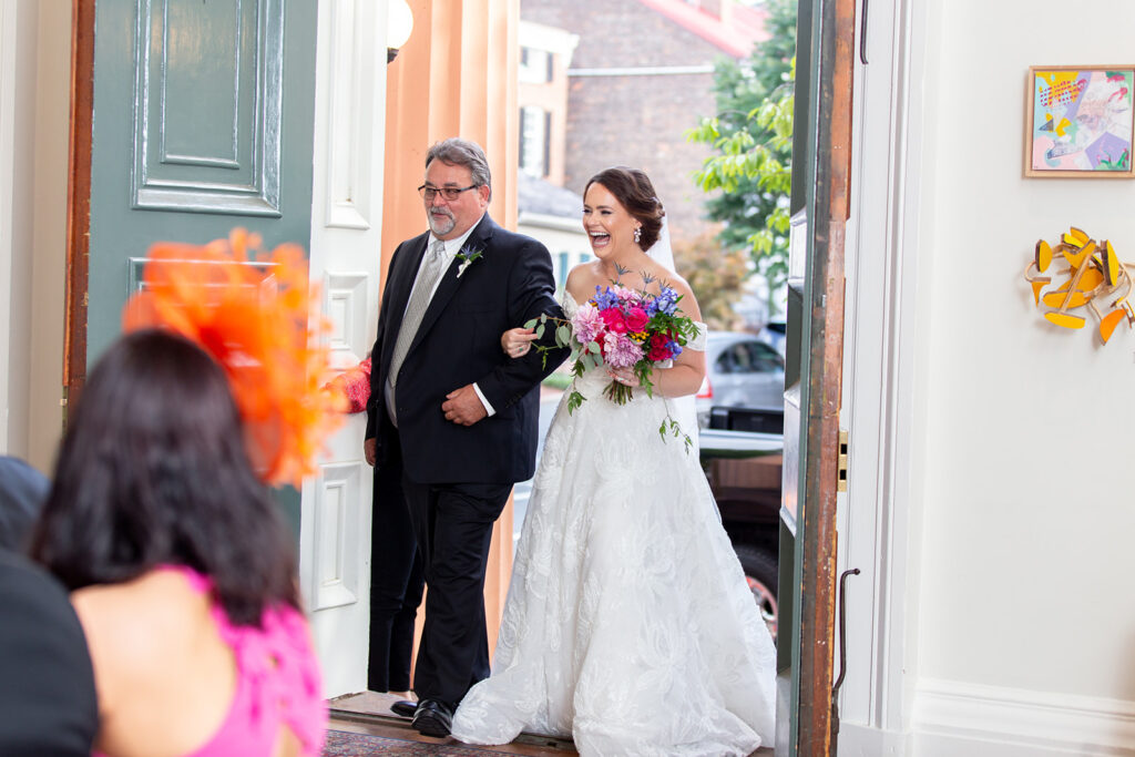 Bride entering the ceremony space at the Athenaeum in Alexandria, Virginia during an intimate wedding.