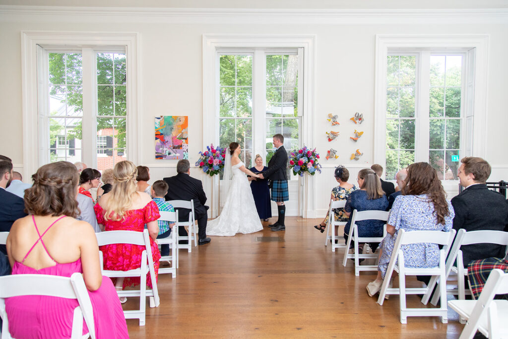 Wide view of an intimate wedding ceremony at the Athenaeum in Alexandria, Virginia.