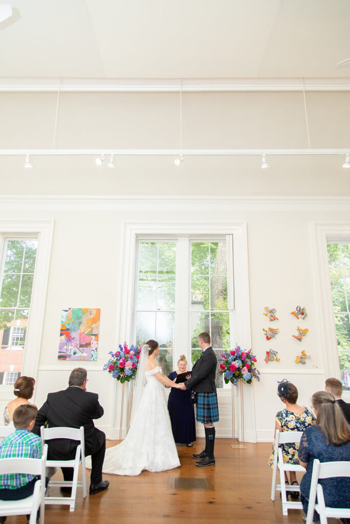 Wide view of an intimate wedding ceremony at the Athenaeum in Alexandria, Virginia.