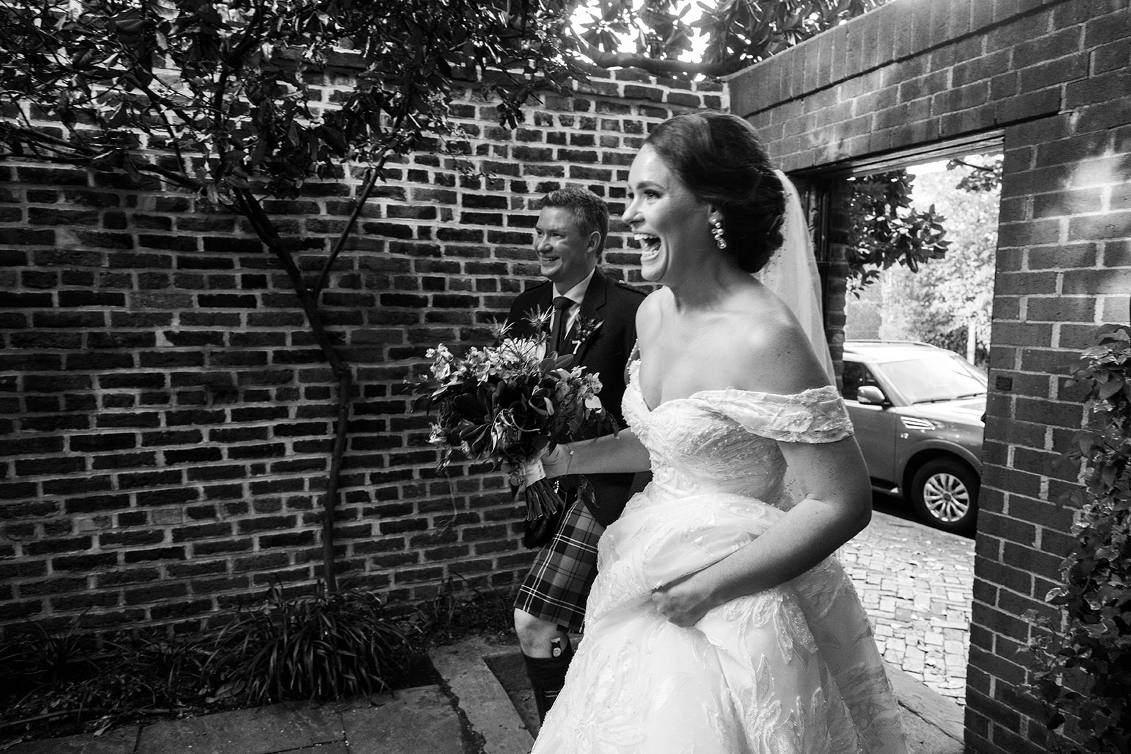 Bride and groom entering cocktail hour at the Athenaeum in Alexandria after their intimate wedding ceremony.