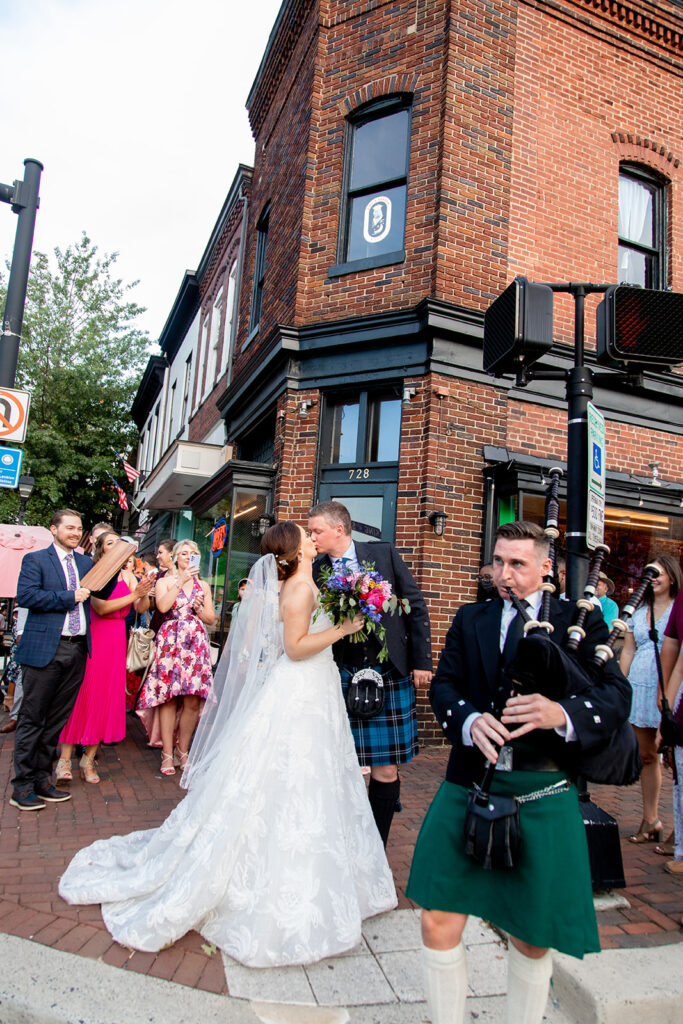 Bride and groom celebrating with guests during a downtown Alexandria wedding processional.