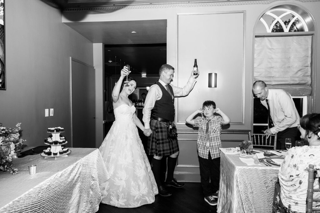 Bride and groom entering their wedding reception at the Morrison House in Alexandria.