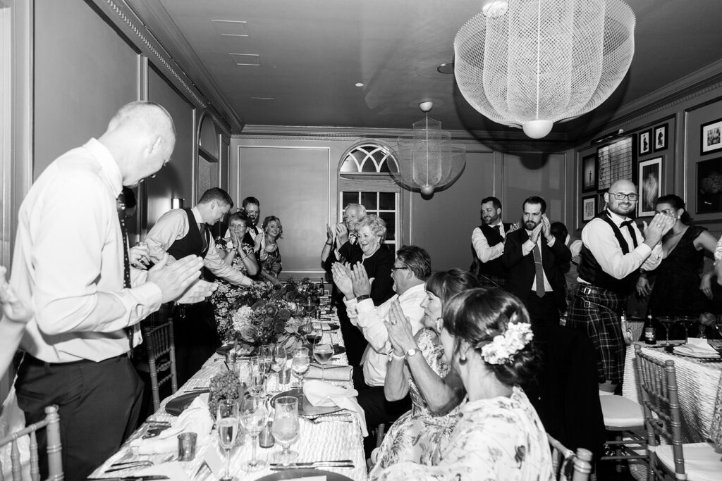Wedding guests reacting during toasts at a Morrison House wedding reception in Alexandria.