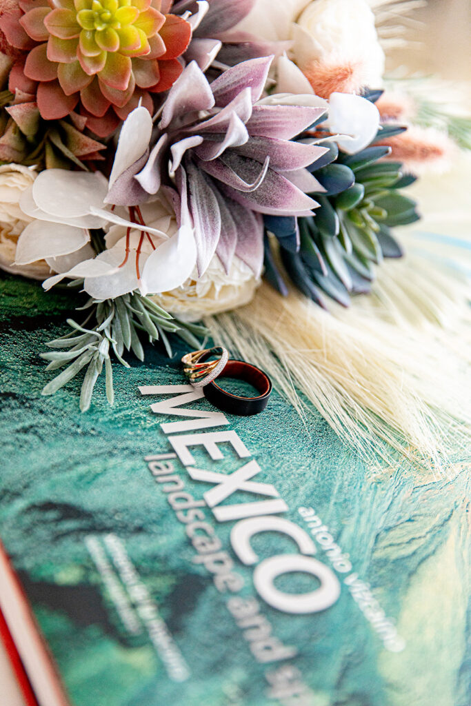 Luxury destination wedding details at Le Blanc Cancun featuring rings and Mexico-inspired elements