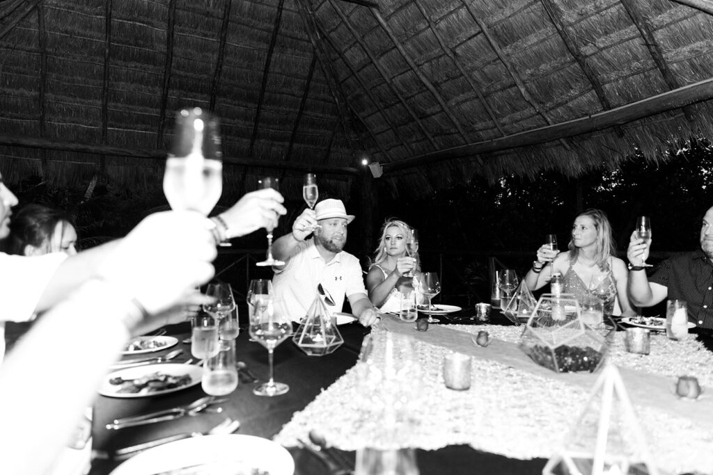 Intimate wedding dinner toast at Le Blanc Cancun destination wedding