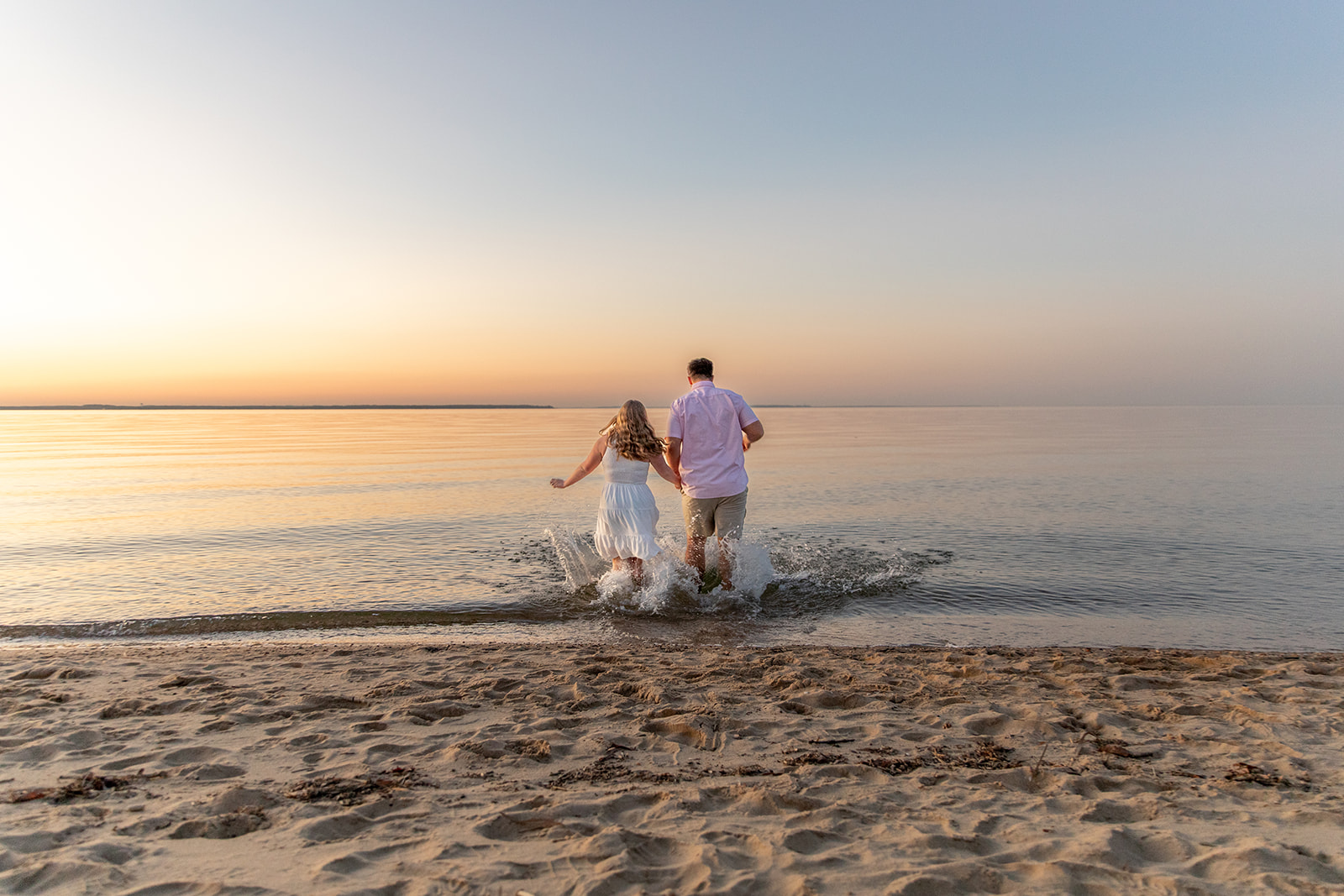 Beach engagement photos near DC of Ryan and Julia at Terrapin Nature Park during a bay sunset