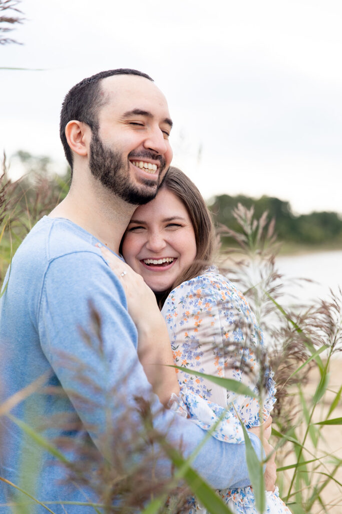 Coastal engagement photos near DC of a couple surrounded by tall grasses at Terrapin Nature Park