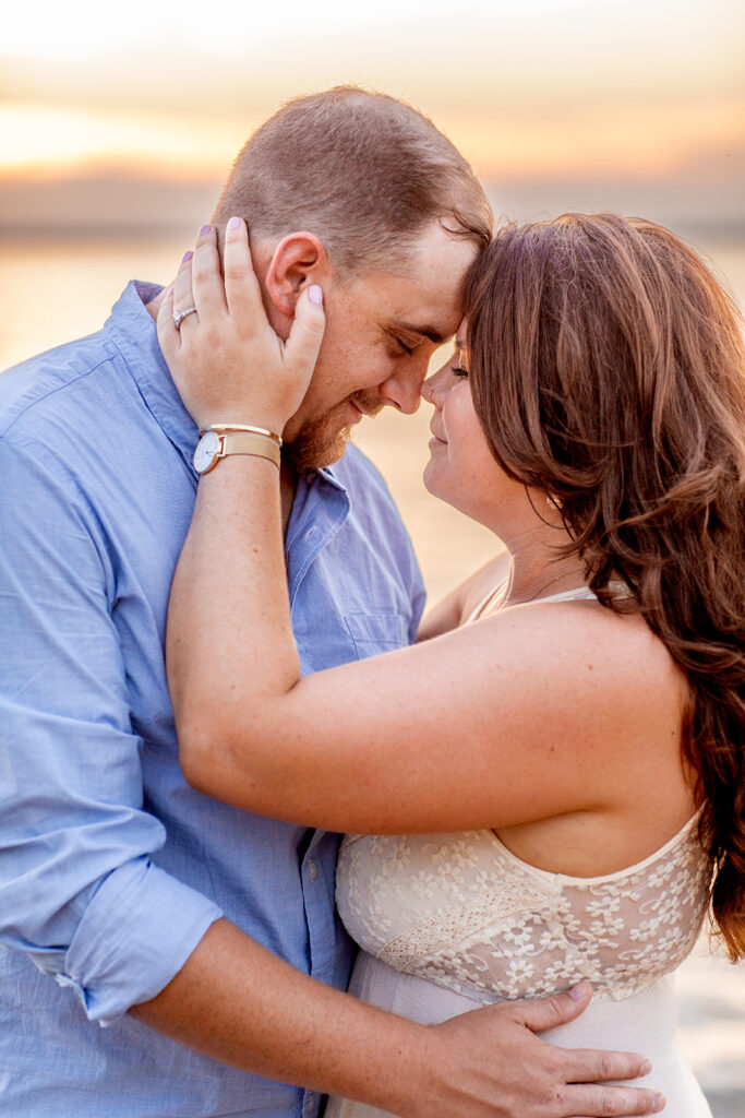 Close-up of Hope and Tyler holding each other during their Terrapin Nature Park engagement session.