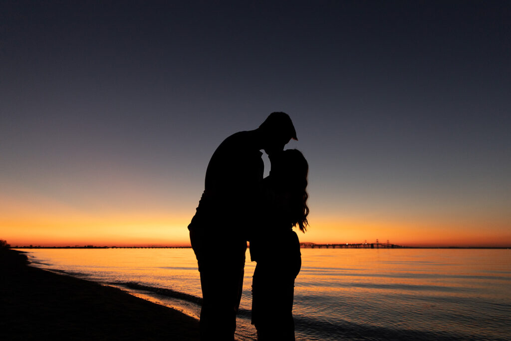 Sunset engagement photos near DC featuring a silhouette couple at Terrapin Nature Park