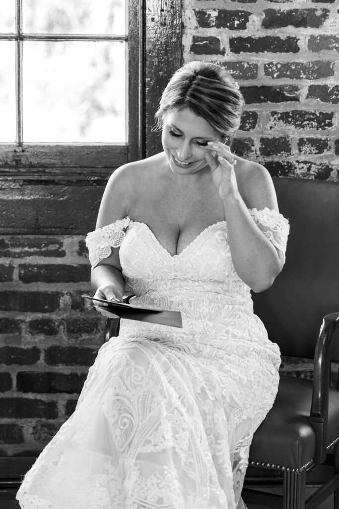 Emotional first look with private letters at Woolen Mill wedding