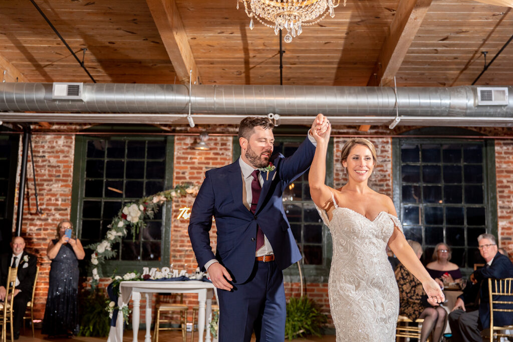Wedding reception with exposed brick at The Woolen Mill