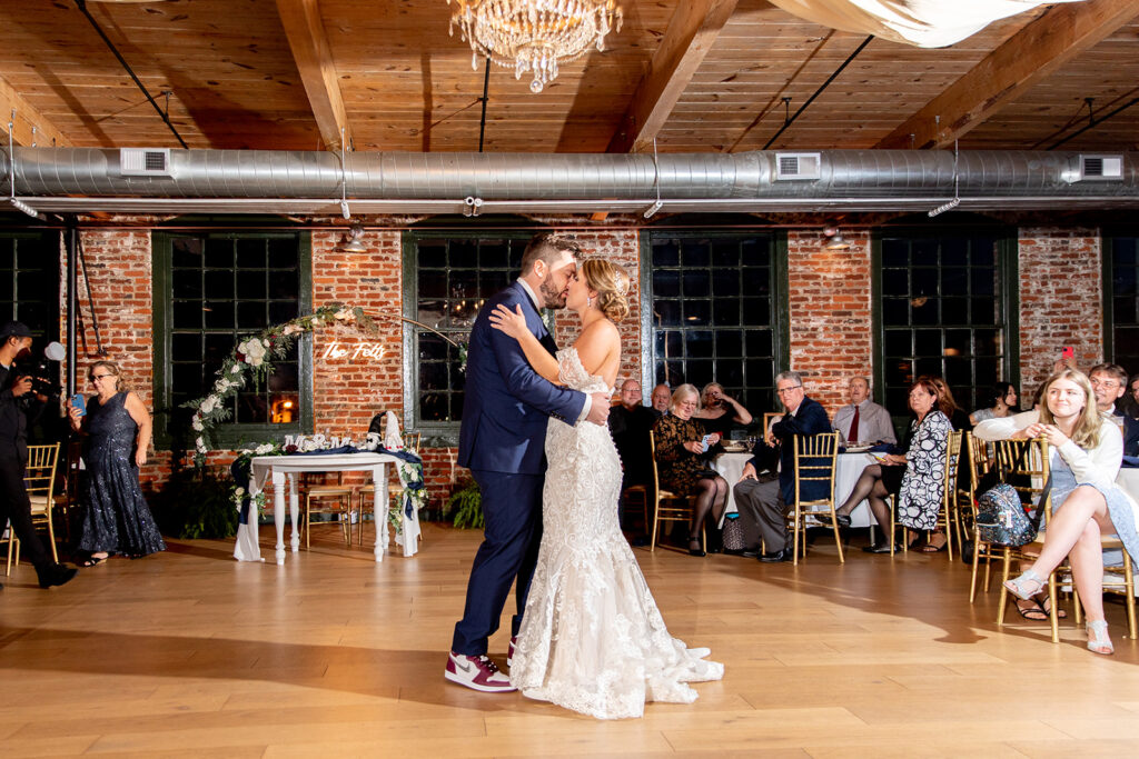 Wedding reception with exposed brick at The Woolen Mill