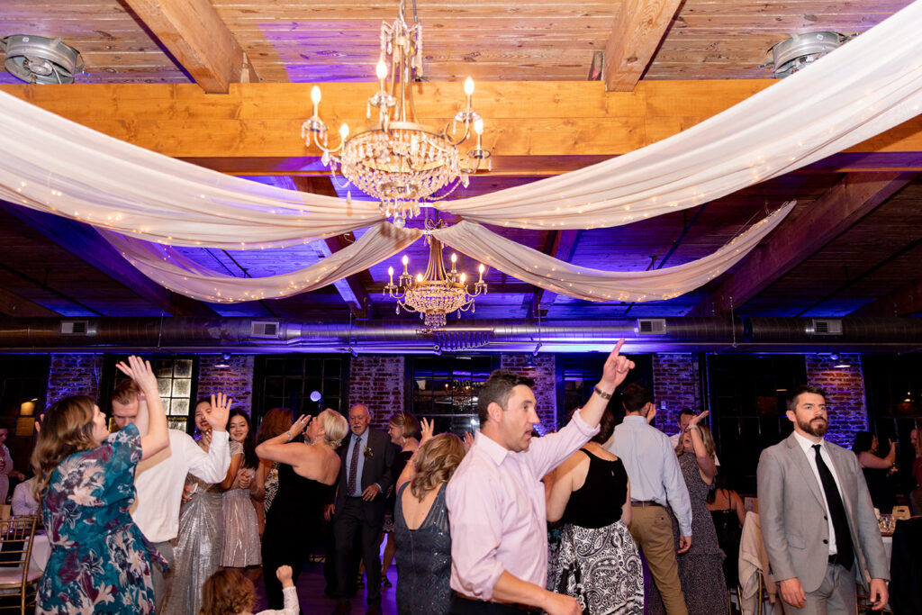 Wedding reception with exposed brick at The Woolen Mill