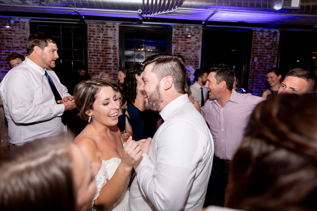 Wedding reception with exposed brick at The Woolen Mill