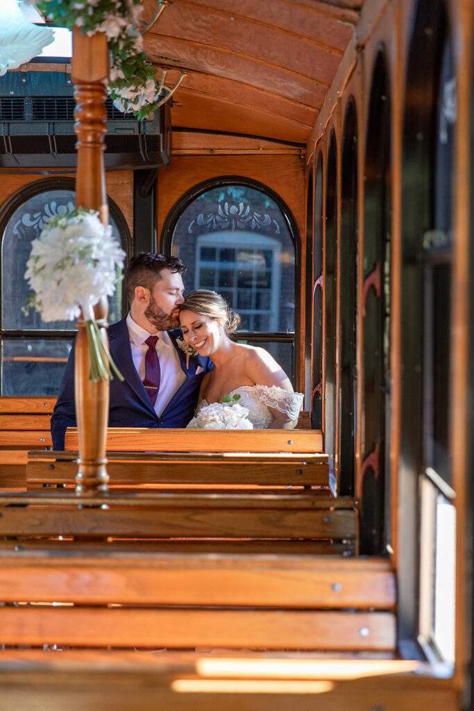 Bride and groom photos on the Fredericksburg Trolley at the Woolen Mill