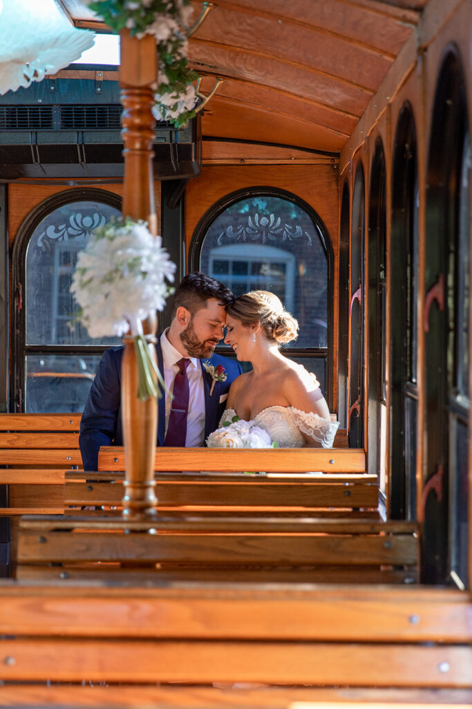 Bride and groom photos on the Fredericksburg Trolley at the Woolen Mill